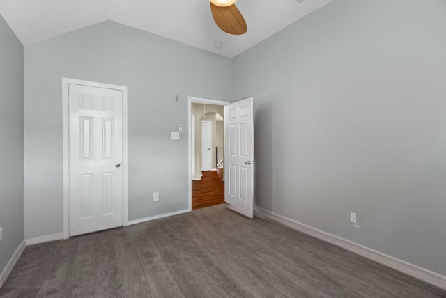 6006 Gilman Trace Ln, Houston, TX 77092 - unfurnished bedroom featuring wood finished floors, arched walkways, vaulted ceiling, and a ceiling fan