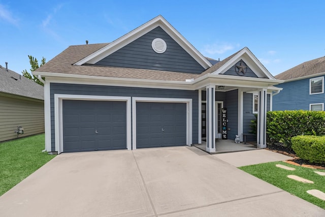 6006 Gilman Trace Ln, Houston, TX 77092 - view of front of home featuring concrete driveway, a garage, and a shingled roof