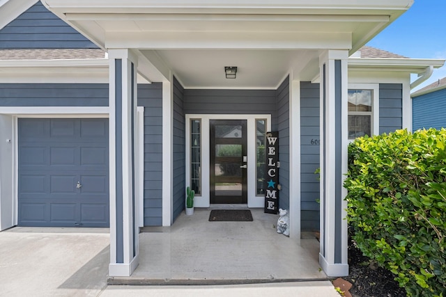 6006 Gilman Trace Ln, Houston, TX 77092 - property entrance featuring roof with shingles and a garage