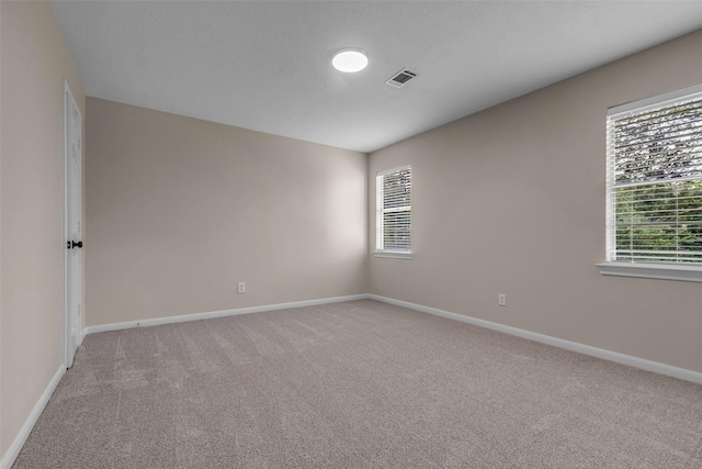 6415 Bayonne Dr, Spring, TX 77389 - empty room with light carpet and plenty of natural light