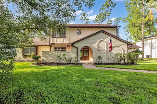 6415 Bayonne Dr, Spring, TX 77389 - view of front of home featuring a front yard and brick siding