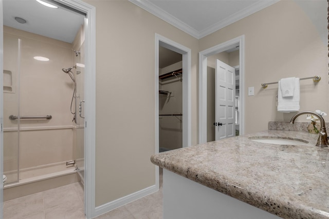 6415 Bayonne Dr, Spring, TX 77389 - full bath featuring a stall shower, vanity, a spacious closet, crown molding, and tile patterned flooring