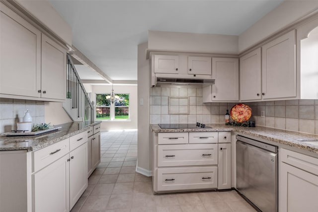 6415 Bayonne Dr, Spring, TX 77389 - kitchen featuring dishwasher, light tile patterned floors, backsplash, light stone counters, and under cabinet range hood