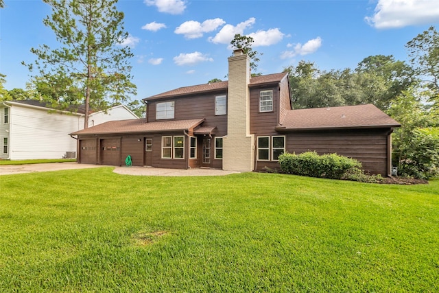 6415 Bayonne Dr, Spring, TX 77389 - rear view of property featuring a garage, a chimney, concrete driveway, a yard, and a shingled roof