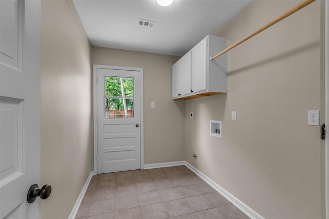 6415 Bayonne Dr, Spring, TX 77389 - washroom featuring cabinet space, washer hookup, hookup for an electric dryer, light tile patterned floors, and gas dryer hookup