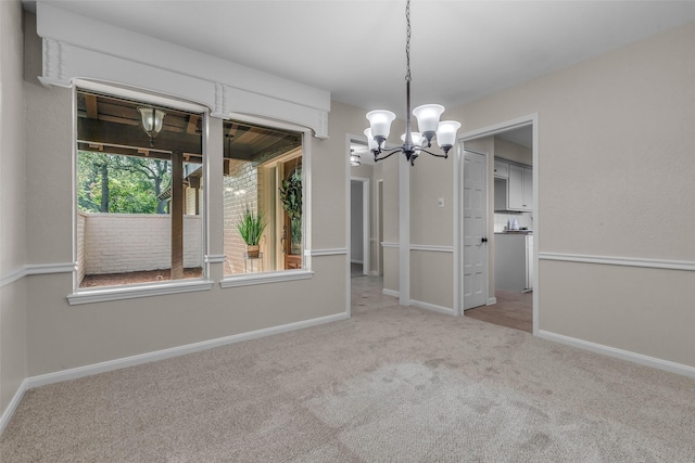 6415 Bayonne Dr, Spring, TX 77389 - unfurnished dining area with a chandelier and carpet floors