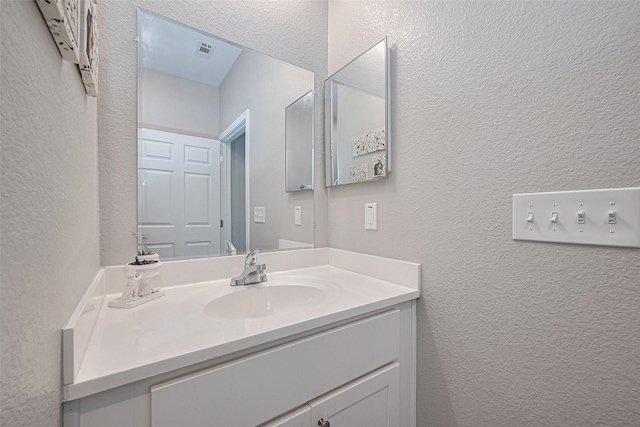 12118 Dumas St, Houston, TX 77034 - bathroom with a textured wall and vanity