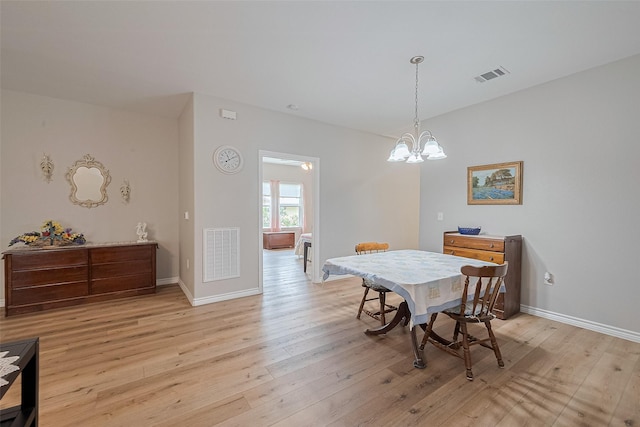 12118 Dumas St, Houston, TX 77034 - dining area featuring light wood-style floors and a chandelier