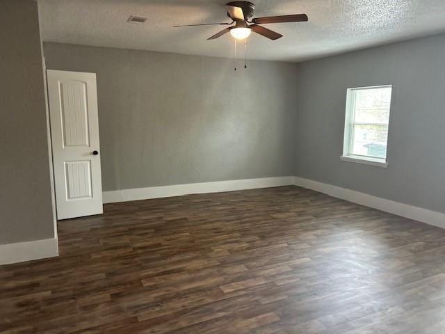 15834 Bazelbriar Ln, Houston, TX 77489 - spare room with a ceiling fan, dark wood-style flooring, and a textured ceiling
