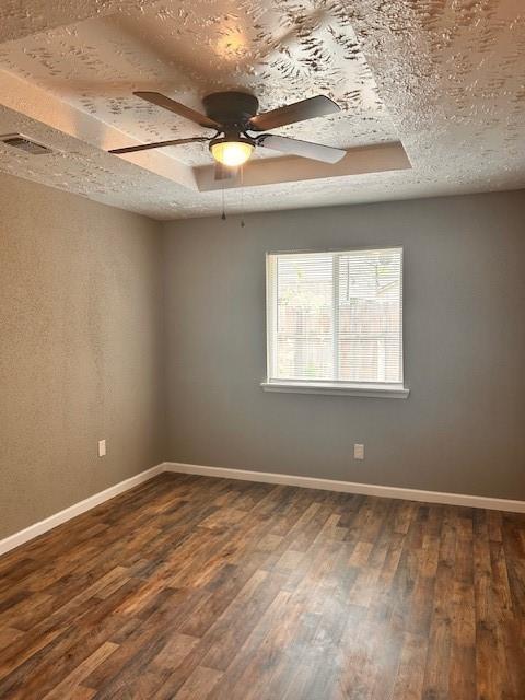 15834 Bazelbriar Ln, Houston, TX 77489 - unfurnished room with dark wood finished floors, a ceiling fan, and a textured ceiling