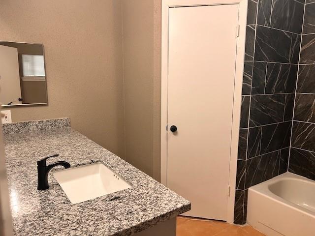15834 Bazelbriar Ln, Houston, TX 77489 - bathroom featuring vanity, tile patterned flooring, and shower / washtub combination