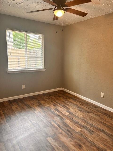 15834 Bazelbriar Ln, Houston, TX 77489 - unfurnished room featuring a ceiling fan, dark wood finished floors, and a textured ceiling