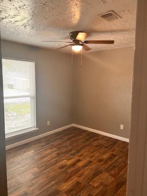 15834 Bazelbriar Ln, Houston, TX 77489 - empty room featuring a ceiling fan, dark wood-style floors, and a textured ceiling