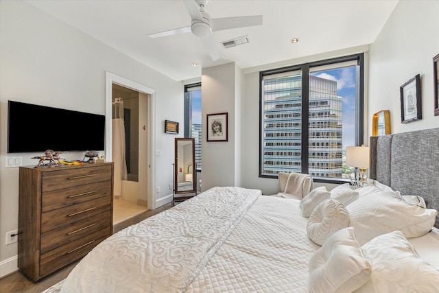 1409 Post Oak Blvd Unit 2204, Houston, TX 77056 - bedroom with wood finished floors and a ceiling fan