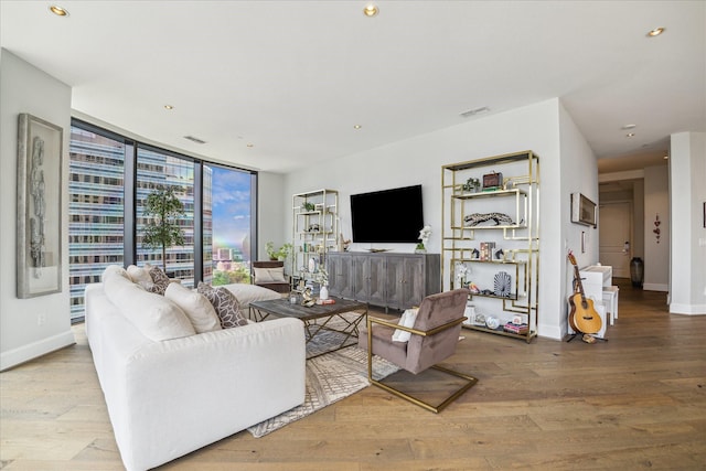 1409 Post Oak Blvd Unit 2204, Houston, TX 77056 - living room with wood finished floors, recessed lighting, and floor to ceiling windows