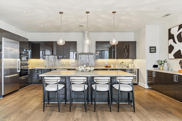 1409 Post Oak Blvd Unit 2204, Houston, TX 77056 - kitchen with high quality fridge, wine cooler, modern cabinets, wall chimney exhaust hood, and recessed lighting