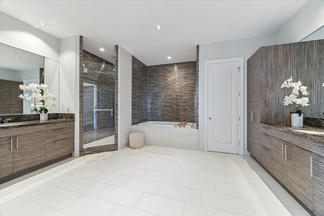 1409 Post Oak Blvd Unit 2204, Houston, TX 77056 - full bath featuring two vanities, a shower stall, a bath, recessed lighting, and tile patterned floors