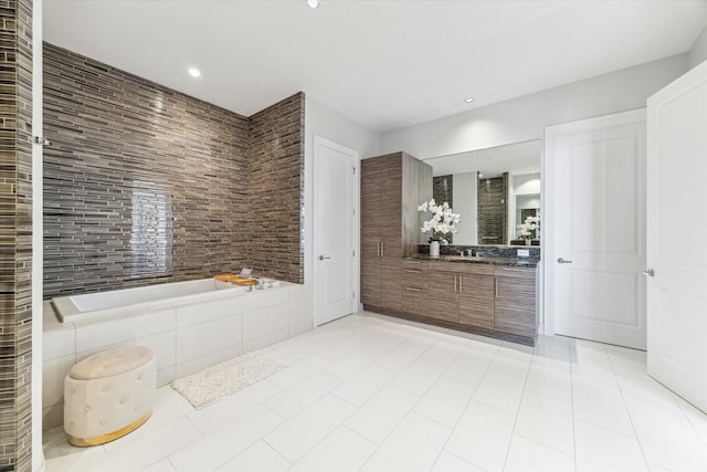 1409 Post Oak Blvd Unit 2204, Houston, TX 77056 - bathroom with vanity, tiled bath, tile patterned floors, and recessed lighting