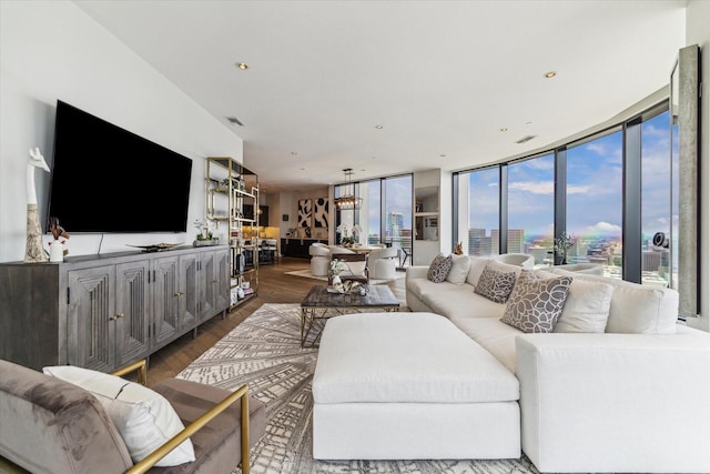1409 Post Oak Blvd Unit 2204, Houston, TX 77056 - living room with wood finished floors, a chandelier, and recessed lighting