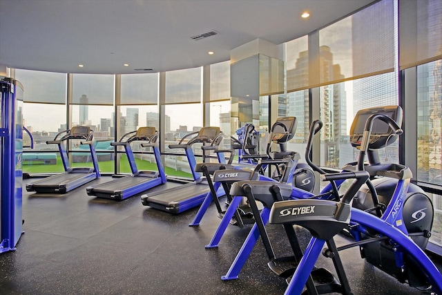 1409 Post Oak Blvd Unit 2204, Houston, TX 77056 - workout area with floor to ceiling windows and a city view