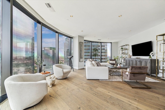 1409 Post Oak Blvd Unit 2204, Houston, TX 77056 - living area featuring hardwood / wood-style floors, recessed lighting, and floor to ceiling windows