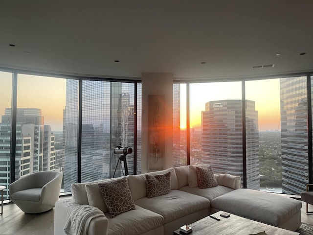 1409 Post Oak Blvd Unit 2204, Houston, TX 77056 - living room with wood finished floors, floor to ceiling windows, and a city view