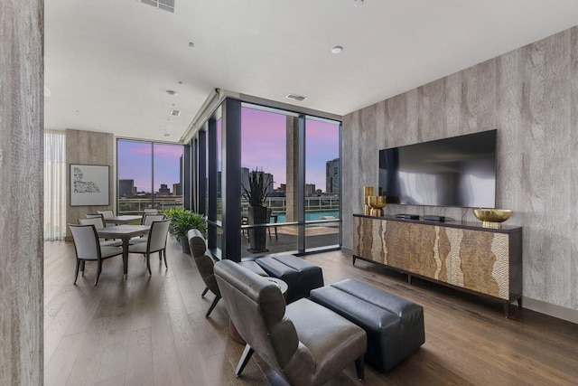 1409 Post Oak Blvd Unit 2204, Houston, TX 77056 - living room featuring floor to ceiling windows and wood finished floors