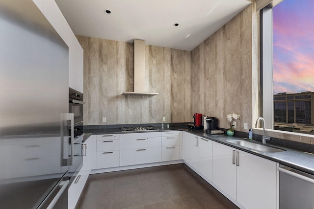 1409 Post Oak Blvd Unit 2204, Houston, TX 77056 - kitchen with modern cabinets, wall chimney exhaust hood, stainless steel appliances, and dark countertops