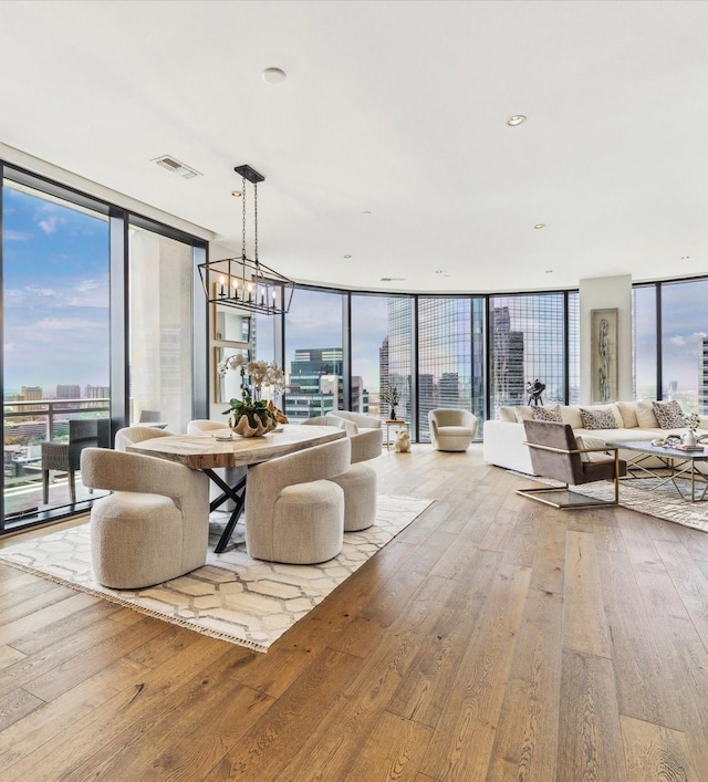 1409 Post Oak Blvd Unit 2204, Houston, TX 77056 - dining space with floor to ceiling windows, hardwood / wood-style flooring, a chandelier, and a view of city