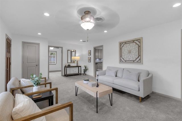 2934 Robertson St, Houston, TX 77009 - living room featuring a ceiling fan, light colored carpet, and recessed lighting
