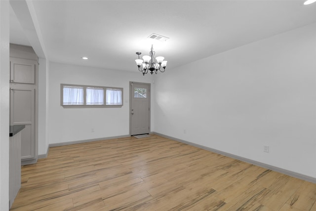 2934 Robertson St, Houston, TX 77009 - unfurnished dining area featuring a chandelier, light wood-style floors, and recessed lighting