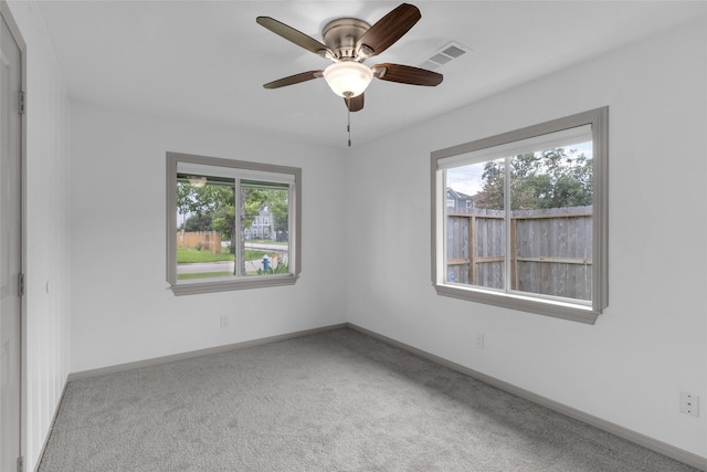 2934 Robertson St, Houston, TX 77009 - carpeted empty room with baseboards and a ceiling fan