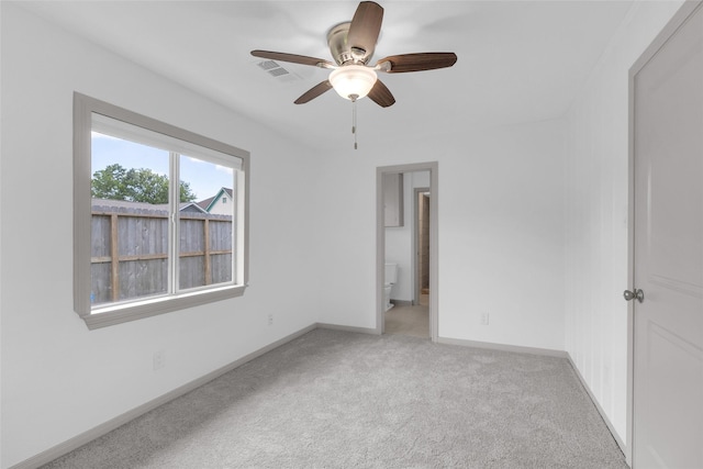 2934 Robertson St, Houston, TX 77009 - spare room featuring light colored carpet and ceiling fan