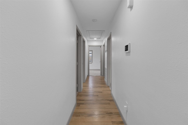 2934 Robertson St, Houston, TX 77009 - hallway featuring attic access and light wood-style floors