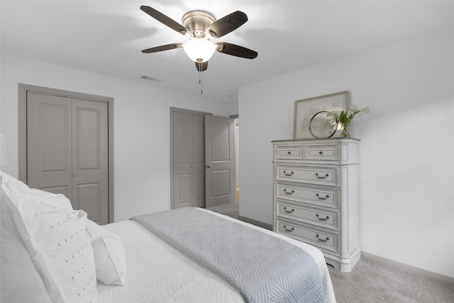 2934 Robertson St, Houston, TX 77009 - bedroom featuring carpet, ceiling fan, and multiple closets