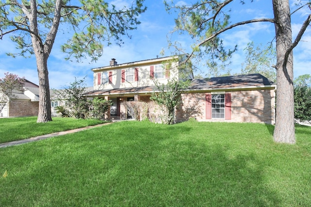 3502 Quail Meadow Dr, Missouri City, TX 77459 - view of front of house featuring a front lawn and a chimney