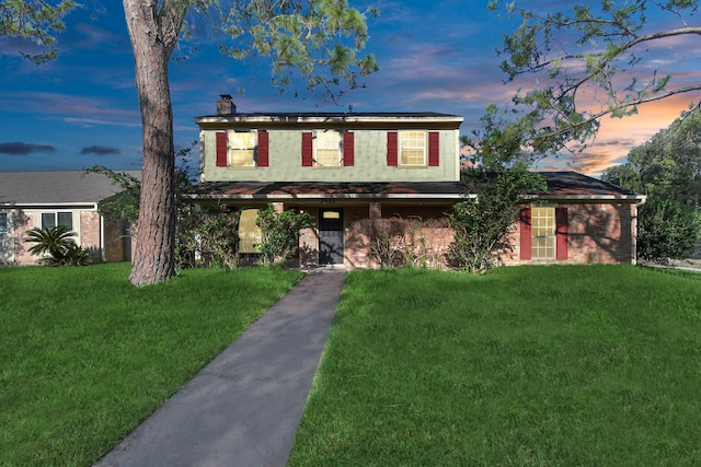 3502 Quail Meadow Dr, Missouri City, TX 77459 - traditional-style home featuring a front lawn and a chimney