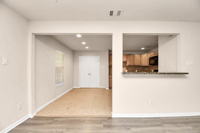3502 Quail Meadow Dr, Missouri City, TX 77459 - kitchen featuring black microwave, recessed lighting, backsplash, and light tile patterned flooring
