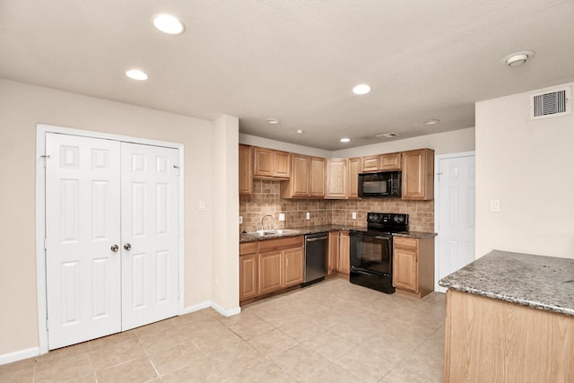 3502 Quail Meadow Dr, Missouri City, TX 77459 - kitchen with black appliances, backsplash, dark stone countertops, light tile patterned floors, and recessed lighting