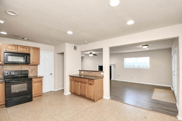 3502 Quail Meadow Dr, Missouri City, TX 77459 - kitchen featuring black appliances, tasteful backsplash, open floor plan, dark stone counters, and recessed lighting