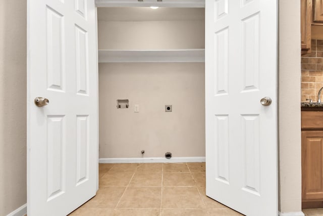 3502 Quail Meadow Dr, Missouri City, TX 77459 - laundry area with washer hookup, hookup for an electric dryer, light tile patterned floors, and gas dryer hookup
