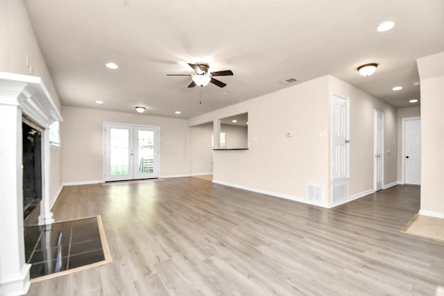 3502 Quail Meadow Dr, Missouri City, TX 77459 - unfurnished living room with a fireplace, a ceiling fan, recessed lighting, and wood finished floors
