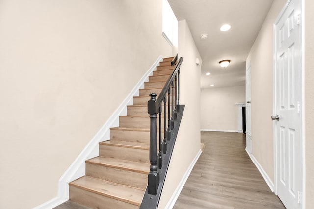 3502 Quail Meadow Dr, Missouri City, TX 77459 - staircase featuring wood finished floors and recessed lighting