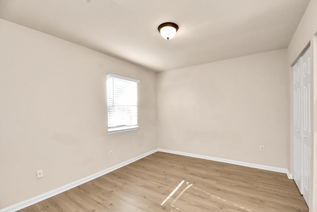 3502 Quail Meadow Dr, Missouri City, TX 77459 - unfurnished bedroom with a closet and light wood-style floors