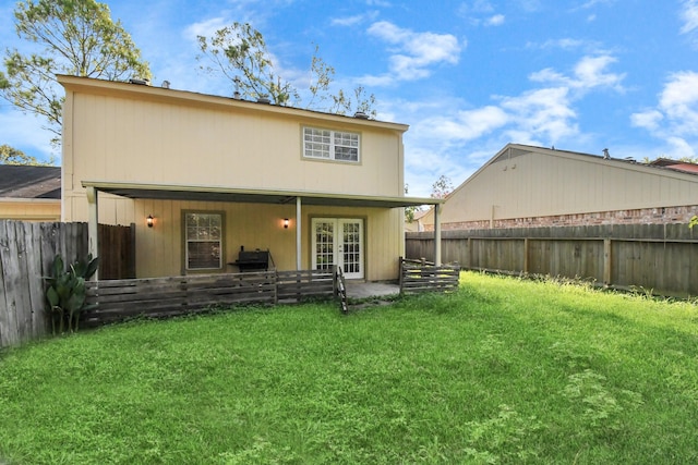 3502 Quail Meadow Dr, Missouri City, TX 77459 - back of property featuring french doors and a fenced backyard