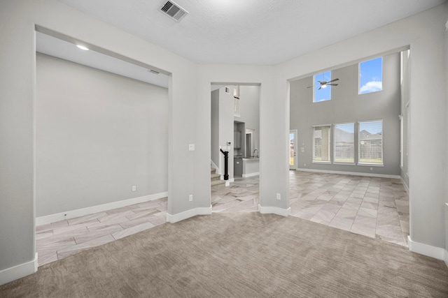 13207 Terania Cliff Trce, Houston, TX 77059 - unfurnished room featuring light carpet, stairway, and ceiling fan