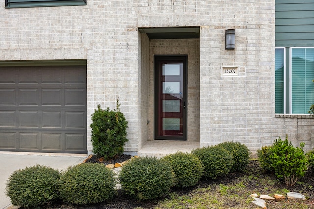 13207 Terania Cliff Trce, Houston, TX 77059 - entrance to property with a garage and brick siding