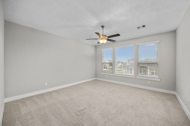 13207 Terania Cliff Trce, Houston, TX 77059 - spare room with ceiling fan, a textured ceiling, and light colored carpet