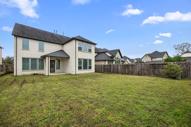 13207 Terania Cliff Trce, Houston, TX 77059 - back of property with a fenced backyard, a patio area, and stucco siding