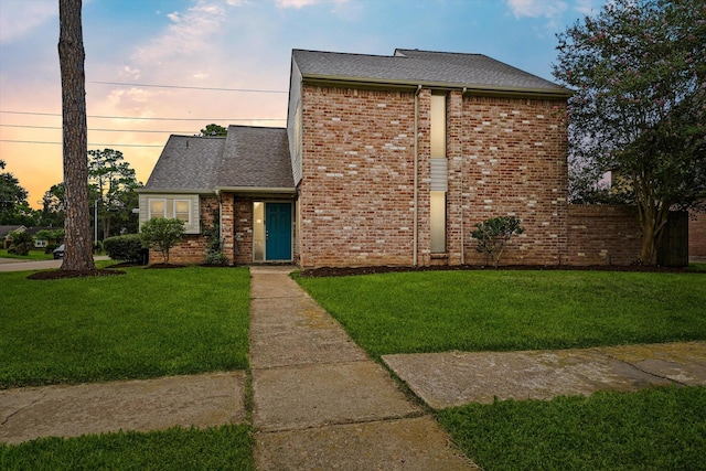 4790 Whispering Falls Dr, Houston, TX 77084 - mid-century inspired home with a front lawn, a shingled roof, and brick siding
